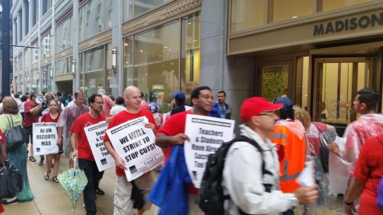 CTU teachers protest outside a Chicago Public Schools Board of Education meeting on Aug. 24. Teachers and schools across Chicago will spend the rest of this week voting whether or not to authorize a possible strike later this year. (Matt Masterson / Chicago Tonight)