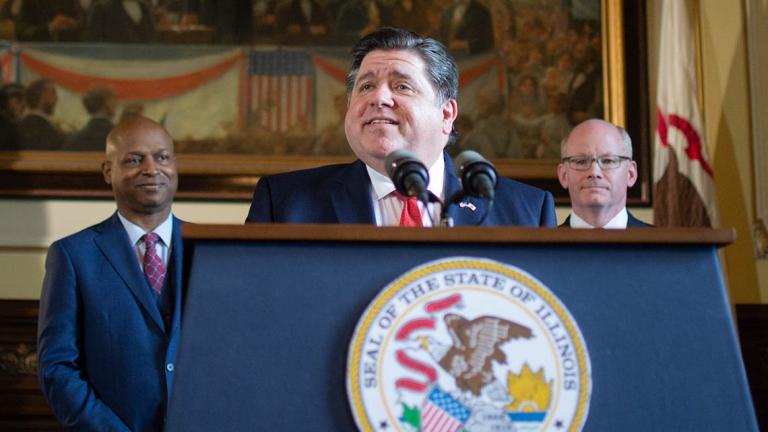 Gov. JB Pritzker holds a news conference alongside House Speaker Chris Welch, left, and Senate President Don Harmon in May 2023 at the Illinois Capitol. (Jerry Nowicki / Capitol News) 