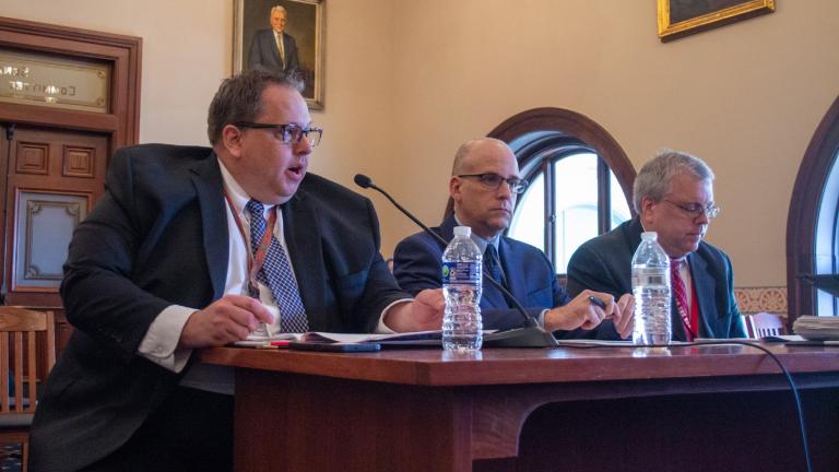 Commission on Government Forecasting and Accountability chief economist Ben Varner (left to right), revenue manager Eric Noggle and executive director Clayton Klenke testify at the commission’s annual revenue update meeting in Springfield Tuesday. (Jerry Nowicki / Capitol News Illinois)
