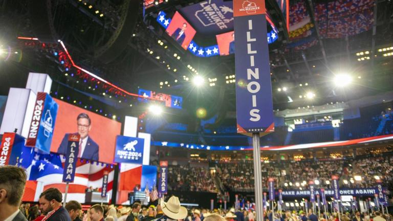 On the floor of the Republican National Convention, delegates rally around signs for their state during votes and speeches on Monday, July 15, 2024. (Andrew Adams / Capitol News Illinois)