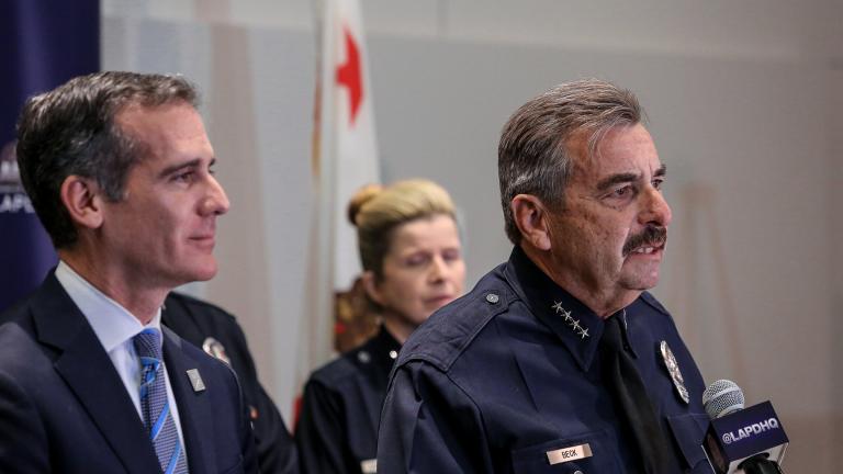 Charlie Beck, right, speaks during a press conference in 2018 while Los Angeles Mayor Eric Garcetti, left, looks on. On Friday, the former LAPD chief was named Chicago’s interim police superintendent. (Eric Garcetti / Flickr)