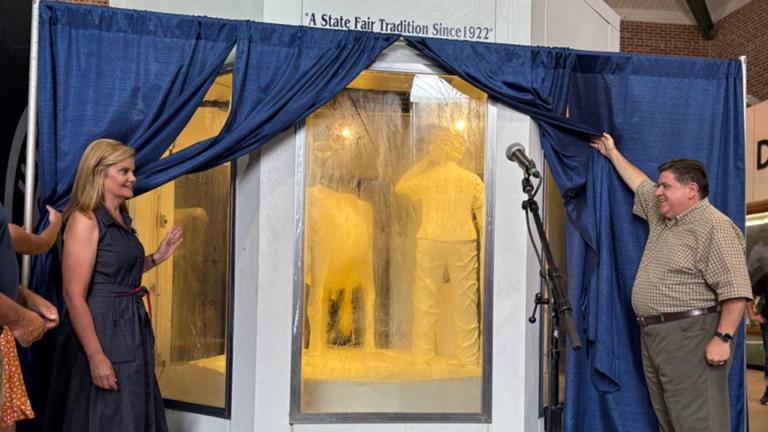 Gov. JB Pritzker and wife MK unveil the 2025 Illinois State Fair butter cow on Wednesday, Aug. 6, 2025, in Springfield. (Jerry Nowicki / Capitol News Illinois)