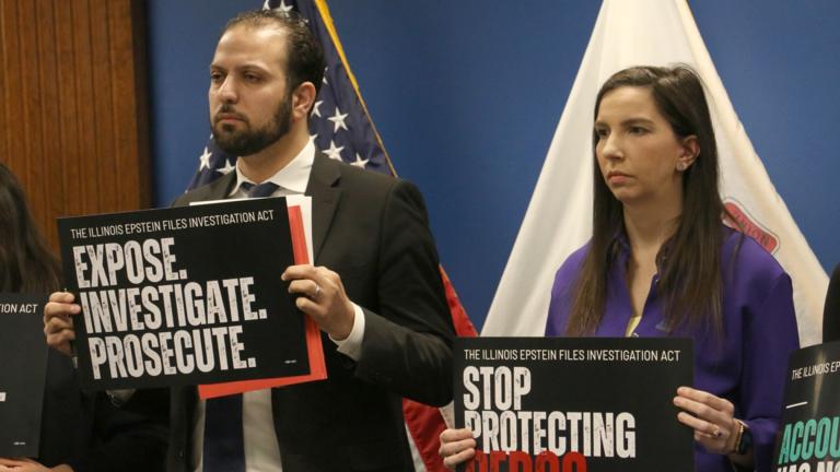 State Rep. Abdelnasser Rashid and state Rep. Anne Stava hold signs promoting the Illinois Epstein Files Investigation Act at a news conference in downtown Chicago on March 2, 2026. (Maggie Dougherty / Capitol News Illinois)