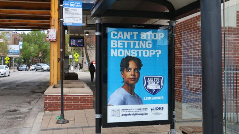 A Chicago bus stop advertises the state’s gambling addiction helpline. (Maggie Dougherty / Capitol News Illinois)