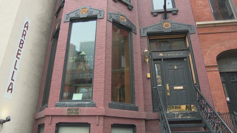 A brick building in the Italianate style at 110 W. Grand Ave. (Felix Mendez / WTTW News)