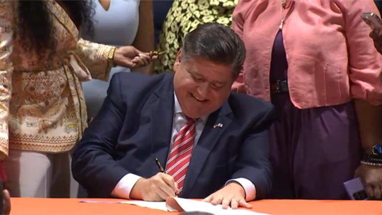 Gov. JB Pritzker signs a bill overhauling the state's mandatory supervised release program for former inmates who have completed their prison sentences. (Credit: Illinois.gov)