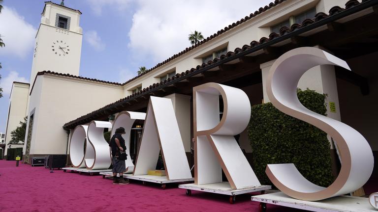 An Academy Awards crew member looks over a background element for the red carpet at Union Station, one of the locations for Sunday’s 93rd Academy Awards, Saturday, April 24, 2021, in Los Angeles. (AP Photo / Chris Pizzello)
