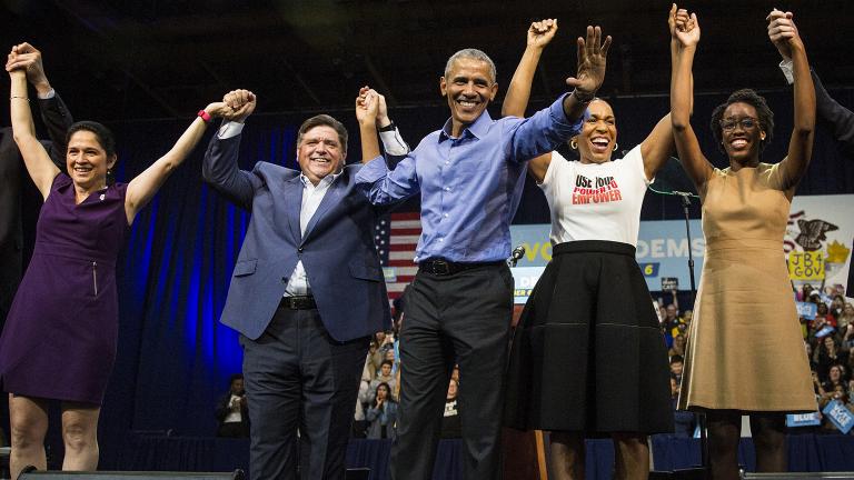 Former President Barack Obama, center, headlines a rally and appears alongside, from left to right, Illinois Comptroller Susana Mendoza, gubernatorial candidate J.B. Pritzker, lieutenant governor candidate Juliana Stratton and congressional candidate Lauren Underwood on Sunday, Nov. 4, 2018 at the University of Illinois at Chicago. (Ashlee Rezin / Chicago Sun-Times via AP)