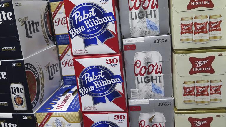 In this photo taken on Thursday, Nov. 8, 2018, cases of Pabst Blue Ribbon and Coors Light are stacked next to each other in a Milwaukee liquor store. (Ivan Moreno / AP Photo)