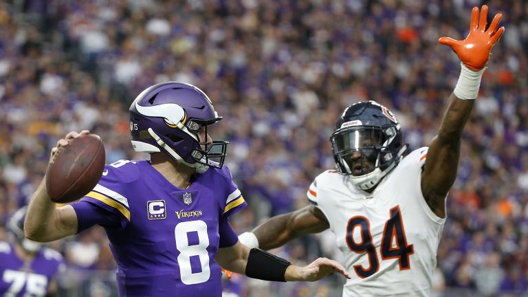 Minnesota Vikings quarterback Kirk Cousins (8) looks to throw a pass over Chicago Bears outside linebacker Leonard Floyd (94) during the first half of an NFL football game, Sunday, Dec. 30, 2018. (Bruce Kluckhohn / AP Photo) Minnesota Vikings quarterback Kirk Cousins (8) looks to throw a pass over Chicago Bears outside linebacker Leonard Floyd (94) during the first half of an NFL football game, Sunday, Dec. 30, 2018. (Bruce Kluckhohn / AP Photo)