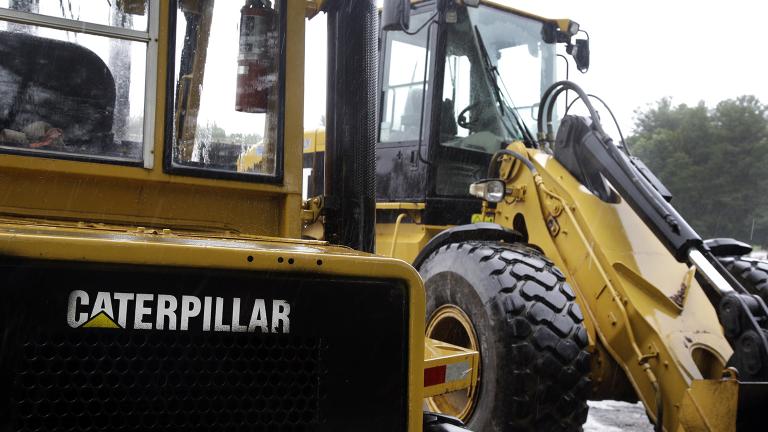 In this Monday, July 24, 2017 file photo, Caterpillar loaders are parked in Middleton, Massachusetts.  (AP Photo / Elise Amendola) 
