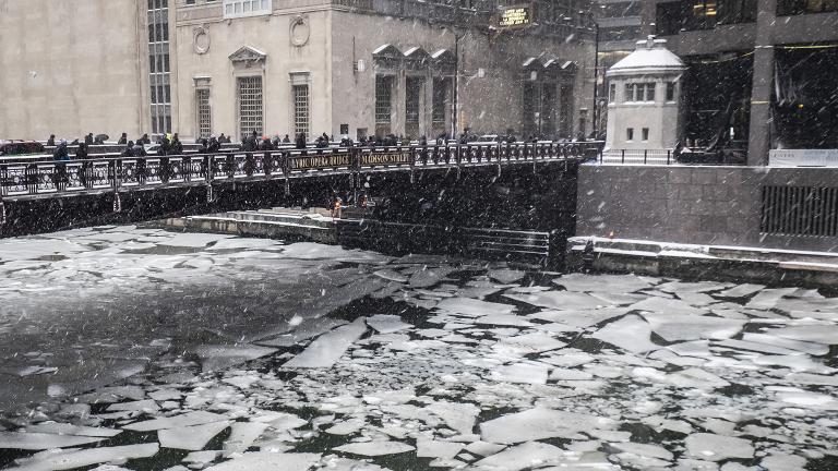 Pedestrians cross an icy Chicago River on Madison Street near the Civic Opera House on Monday, Jan. 28, 2019. (Rich Hein / Chicago Sun-Times via AP) Pedestrians cross an icy Chicago River on Madison Street near the Civic Opera House on Monday, Jan. 28, 2019. (Rich Hein / Chicago Sun-Times via AP)