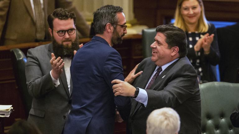 Gov. J.B. Pritzker, right, congratulates state Rep. Will Guzzardi, D-Chicago, left, on the House floor at the Illinois State Capitol on Thursday, Feb. 14, 2019. (Justin L. Fowler / The State Journal-Register via AP)