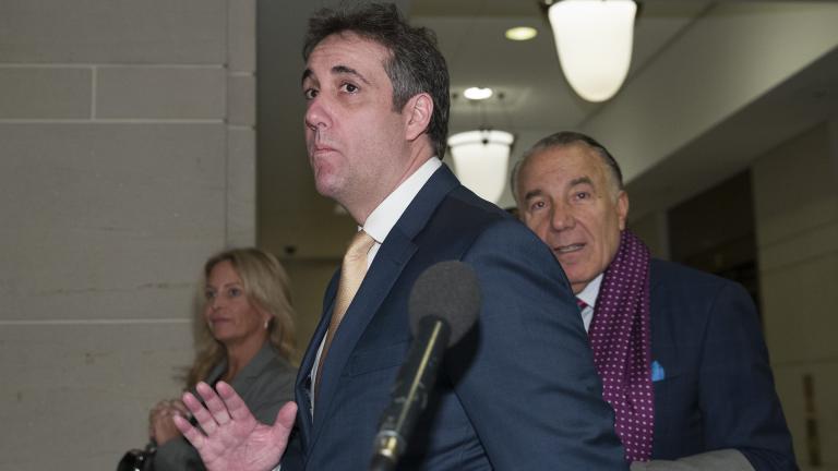 Michael Cohen, center, President Donald Trump's former lawyer, arrives to testify before a closed-door hearing of the House Intelligence Committee accompanied by his lawyer, Michael Monico of Chicago, on Capitol Hill, Thursday, Feb. 28, 2019, in Washington. (AP Photo/Alex Brandon)