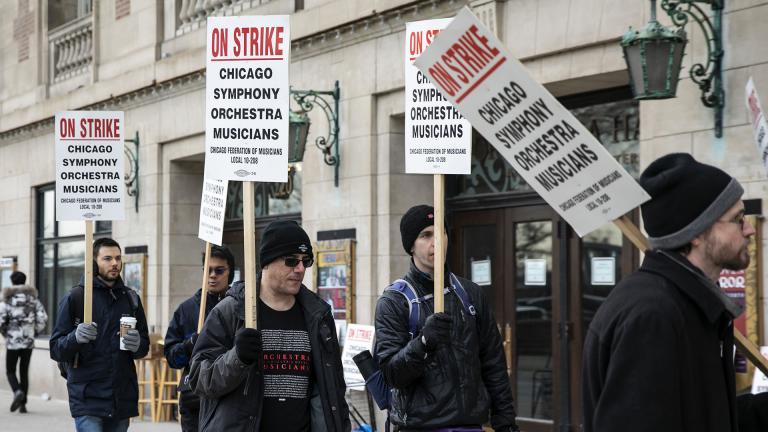 Musicians of the Chicago Symphony Orchestra go on strike and walk the picket line outside the doors of Orchestra Hall on Michigan Avenue, Monday, March 11, 2019. (Ashlee Rezin / Chicago Sun-Times via AP)