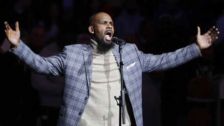 In this Nov. 17, 2015, file photo, musical artist R. Kelly performs the national anthem before an NBA basketball game between the Brooklyn Nets and the Atlanta Hawks in New York. (AP Photo / Frank Franklin II, File) In this Nov. 17, 2015, file photo, musical artist R. Kelly performs the national anthem before an NBA basketball game between the Brooklyn Nets and the Atlanta Hawks in New York. (AP Photo / Frank Franklin II, File)