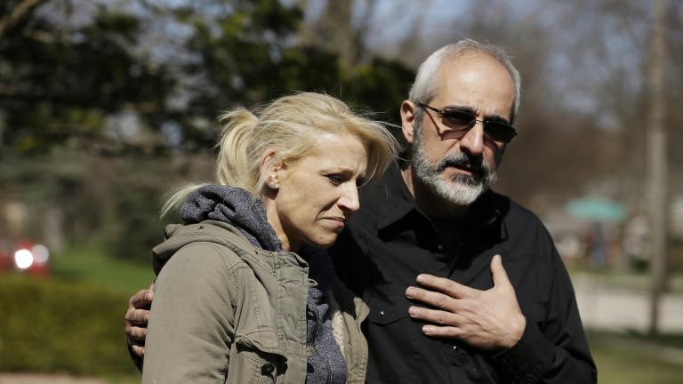 JoAnn Cunningham, mother of missing 5-year-old child Andrew “AJ” Freund, stands with her attorney George Kililis outside of the Freund home as he speaks on her behalf and pleads with the public to help find AJ on Friday, April 19, 2019 in Crystal Lake. (Stacey Wescott / Chicago Tribune via AP)