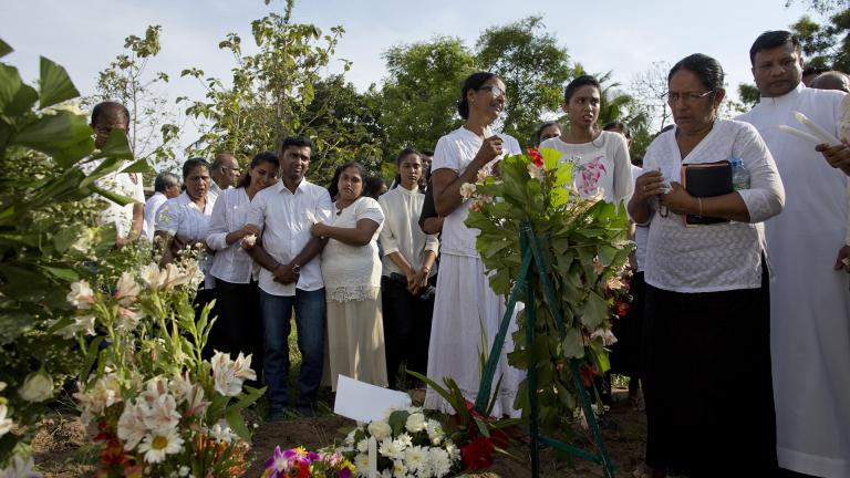 Family members mourn Tuesday, April 23, 2019 at the burial of 7-year-old Dhulodh Anthony, a victim of an Easter Sunday bomb blast, at Methodist cemetery in Negombo, Sri Lanka. (AP Photo / Gemunu Amarasinghe)