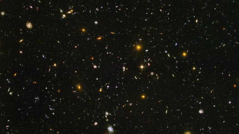 This image made from a composite of September 2003 - January 2004 photos captured by the NASA/ESA Hubble Space Telescope shows nearly 10,000 galaxies in the deepest visible-light image of the cosmos, cutting across billions of light-years. (NASA, ESA, S. Beckwith (STScI), HUDF Team via AP)