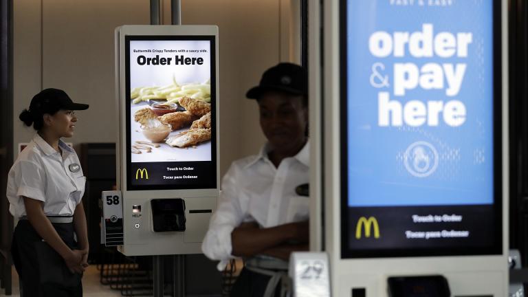 In this Aug. 8, 2018, file photo employees stand in McDonald’s Chicago flagship restaurant. (AP Photo / Nam Y. Huh, File)