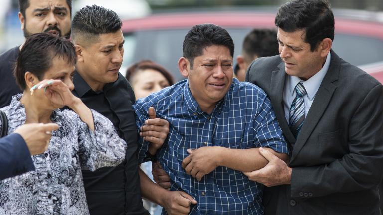 Arnulfo Ochoa, the father of Marlen Ochoa-Lopez, is surrounded by family members and supporters, as he walks into the Cook County medical examiner’s office to identify his daughter’s body, Thursday, May 16, 2019 in Chicago. (Ashlee Rezin / Chicago Sun-Times via AP)
