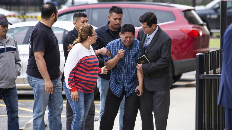 Arnulfo Ochoa, the father of Marlen Ochoa-Lopez, is surrounded by family members and supporters, as he walks into the Cook County medical examiner’s office to identify his daughter’s body, Thursday, May 16, 2019 in Chicago. (Ashlee Rezin / Chicago Sun-Times via AP)