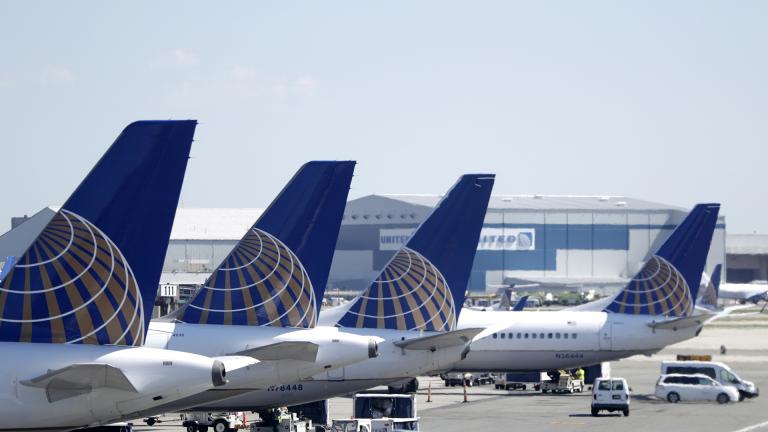 In this July 18, 2018, file photo, United Airlines commercial jets sit at a gate at Terminal C of Newark Liberty International Airport in Newark, N.J. (AP Photo / Julio Cortez, File)