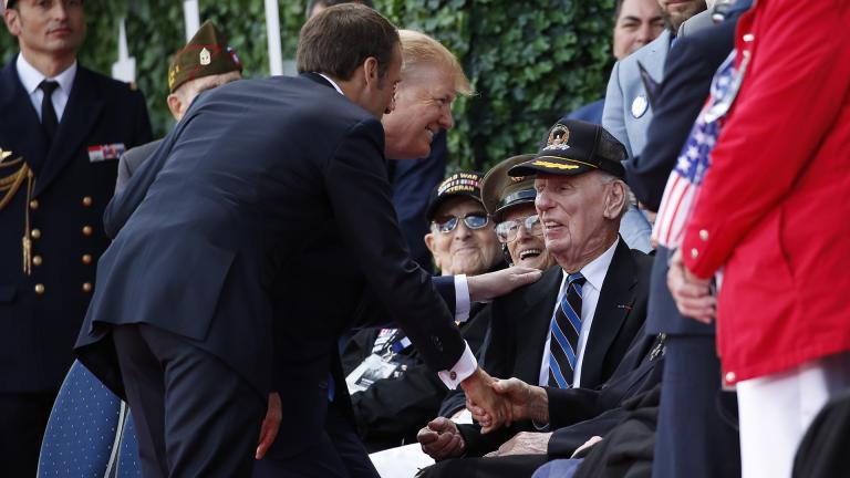 President Donald Trump and French President Emmanuel Macron greet veterans as they arrive to a ceremony to commemorate the 75th anniversary of D-Day at The Normandy American Cemetery, Thursday, June 6, 2019, in Colleville-sur-Mer, Normandy, France. (AP Photo / Alex Brandon)