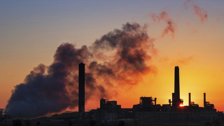 In this July 27, 2018, file photo, the Dave Johnson coal-fired power plant is silhouetted against the morning sun in Glenrock, Wyoming. (AP Photo / J. David Ake, File)