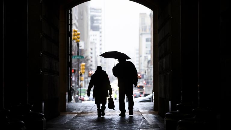 In this Feb. 12, 2019, file photo pedestrians pass beneath City Hall in Philadelphia. (AP Photo / Matt Rourke, File)