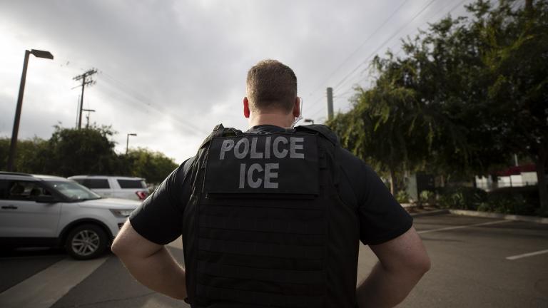 In this July 8, 2019, file photo, a U.S. Immigration and Customs Enforcement officer looks on during an operation in Escondido, California. (AP Photo / Gregory Bull, File)