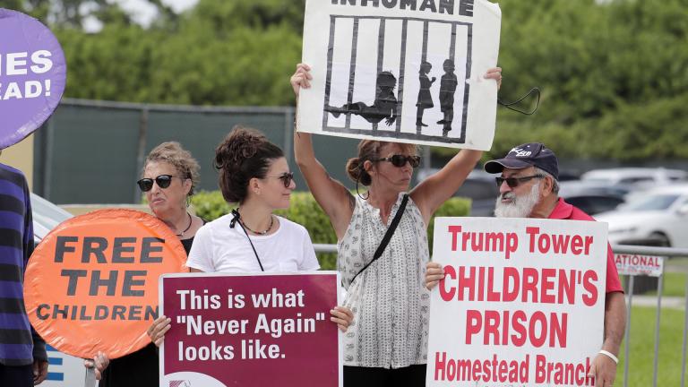 In this July 15, 2019, file photo, protesters hold signs outside of the Homestead Temporary Shelter for Unaccompanied Children while members of Congress tour the facility in Homestead, Florida. (AP Photo / Lynne Sladky, File) In this July 15, 2019, file photo, protesters hold signs outside of the Homestead Temporary Shelter for Unaccompanied Children while members of Congress tour the facility in Homestead, Florida. (AP Photo / Lynne Sladky, File)