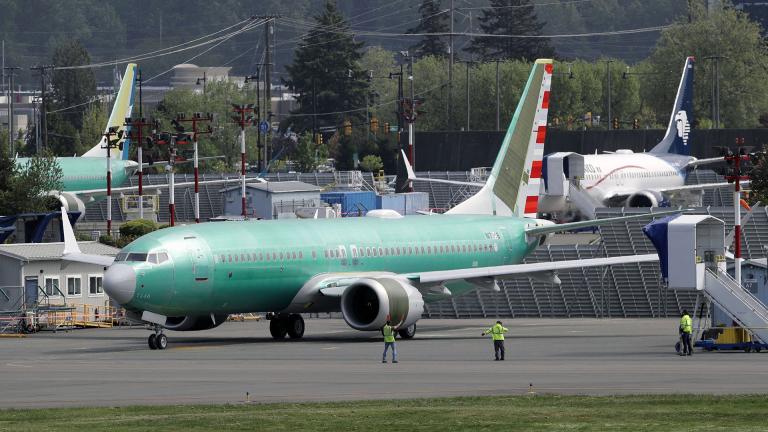 In this Wednesday, May 8, 2019 file photo, workers stand near a Boeing 737 MAX 8 jetliner being built for American Airlines prior to a test flight in Renton, Washington. (AP Photo / Ted S. Warren, File) In this Wednesday, May 8, 2019 file photo, workers stand near a Boeing 737 MAX 8 jetliner being built for American Airlines prior to a test flight in Renton, Washington. (AP Photo / Ted S. Warren, File)