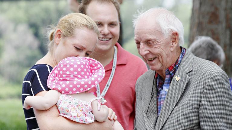 In this July 20, 2014, file photo, United Airlines flight 232 Capt. Al Haynes, right, smiles as he visits with survivors and family members following a remembrance service held in conjunction with the 25th Anniversary of the United Airlines flight 232 crash in Sioux City, Iowa. (AP Photo / The Sioux City Journal, Dawn J. Sagert, File)