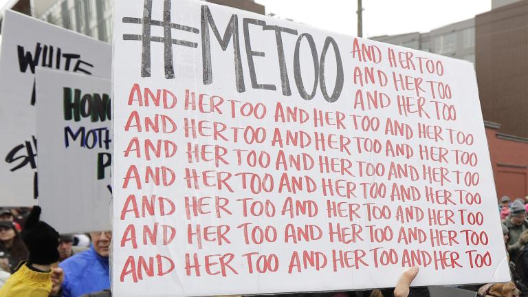 In this Jan. 20, 2018 file photo, a marcher carries a sign with the popular Twitter hashtag #MeToo used by people speaking out against sexual harassment as she takes part in a Women’s March in Seattle.   (AP Photo / Ted S. Warren, File)