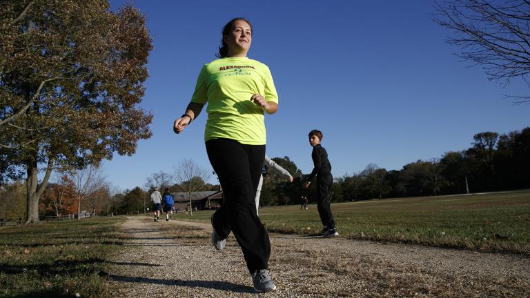 Grace Brown, 14, poses for a portrait while jogging at the park where she does her jogging workouts for her “online PE” class, in Alexandria, Virginia on Friday, Nov. 1, 2019. (AP Photo / Jacquelyn Martin)