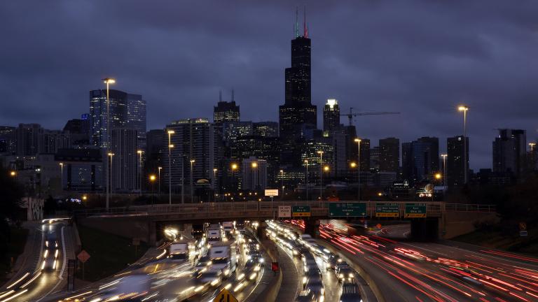 In this Nov. 21, 2018, file photo taken with a long exposure, traffic streaks across the John F. Kennedy Expressway at the start of the Thanksgiving holiday weekend in Chicago. (AP Photo / Kiichiro Sato, File)