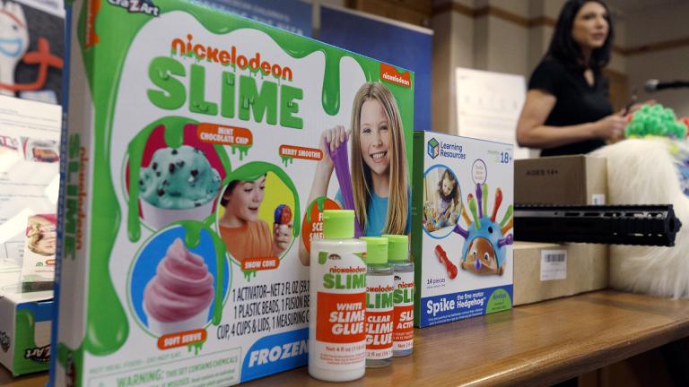 Joan Siff, president of World Against Toys Causing Harm, speaks behind an array of toys, including ice cream-scented Nickelodeon slime, during a news conference in Boston, Tuesday, Nov. 19, 2019. (AP Photo / Michael Dwyer)