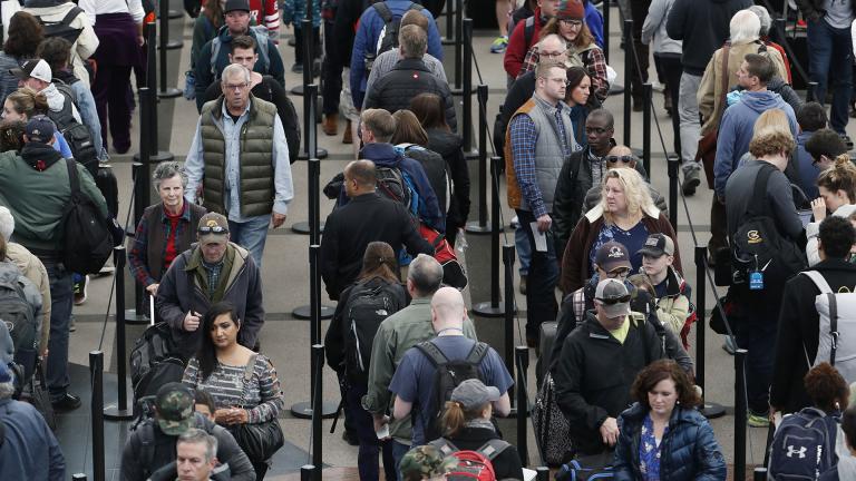In this Nov. 21, 2018, file photo, travelers wait in long lines to pass through a security checkpoint at Denver International Airport in Denver. (AP Photo / David Zalubowski, File)
