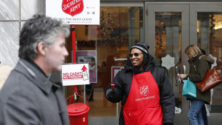 In this Friday, Nov. 15, 2019, photo, bell ringer Carolyn Harper encourages people to donate to the Salvation Army’s annual holiday red kettle campaign on Chicago's Magnificent Mile. (AP Photo / Charles Rex Arbogast) In this Friday, Nov. 15, 2019, photo, bell ringer Carolyn Harper encourages people to donate to the Salvation Army’s annual holiday red kettle campaign on Chicago's Magnificent Mile. (AP Photo / Charles Rex Arbogast)