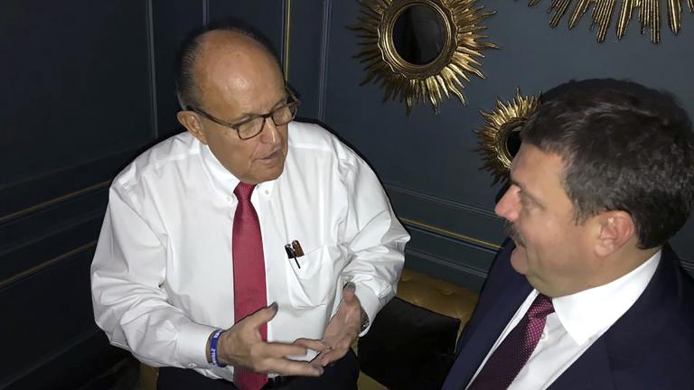 In this handout photo provided by Adriii Derkach’s press office, Rudy Giuliani, an attorney for U.S President Donald Trump, left, meets with Ukrainian lawmaker Adriii Derkach in Kyiv, Ukraine, Thursday, Dec. 5, 2019. (Adriii Derkach’s press office via AP)