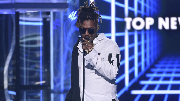 In this May 1, 2019 file photo, Juice WRLD accepts the award for top new artist at the Billboard Music Awards at the MGM Grand Garden Arena in Las Vegas. (Photo by Chris Pizzello / Invision/AP, File) In this May 1, 2019 file photo, Juice WRLD accepts the award for top new artist at the Billboard Music Awards at the MGM Grand Garden Arena in Las Vegas. (Photo by Chris Pizzello / Invision/AP, File)