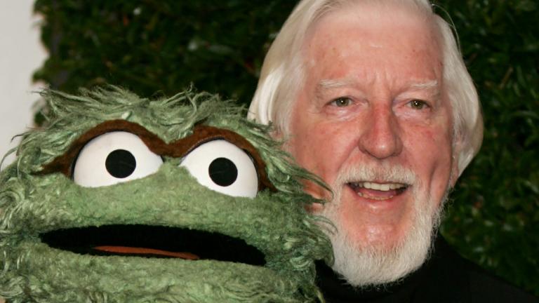 In this Thursday, April 27, 2006, file photo, Caroll Spinney, right, who portrays “Sesame Street” characters Oscar The Grouch, left, and Big Bird, arrives for the Daytime Emmy nominee party at the Hollywood Roosevelt Hotel in Los Angeles. (AP Photo / Reed Saxon, File)