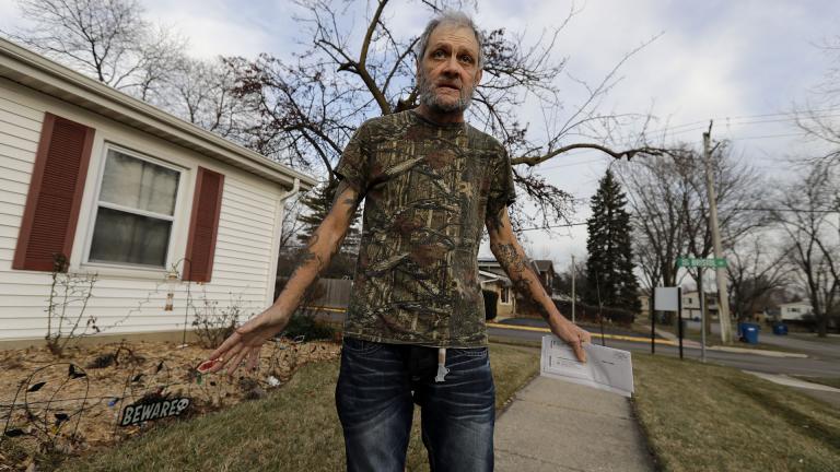 In this Friday, Dec. 20, 2019 photo, Bobby Goldberg walks in front of his home in suburban Chicago. Goldberg has filed a lawsuit claiming he was abused more than 1,000 times in multiple states and countries by the late Donald McGuire, a prominent American Jesuit priest who had close ties to Mother Teresa. (AP Photo / Nam Y. Huh)