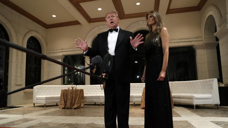 President Donald Trump speaks to the media about the situation at the U.S. embassy in Baghdad, from his Mar-a-Lago property, Tuesday, Dec. 31, 2019, in Palm Beach, Florida, as Melania Trump stands next to him. (AP Photo / Evan Vucci)