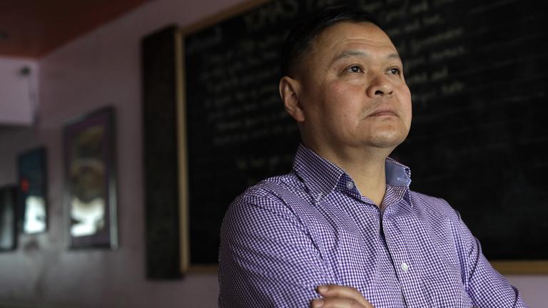 In this Thursday, Feb. 13, 2020, photo, Sai Kyaw, an immigrant from Myanmar, also known as Burma, stands for a photograph in Boston at his restaurant called Yoma. Kyaw said new travel restrictions are preventing his brother, sister and their families from joining him in Massachusetts after nearly a dozen years in the visa application process. (AP Photo / Steven Senne)