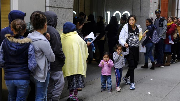 In this Jan. 31, 2019, file photo, hundreds of people overflow onto the sidewalk in a line snaking around the block outside a U.S. immigration office with numerous courtrooms in San Francisco. (AP Photo / Eric Risberg, File) In this Jan. 31, 2019, file photo, hundreds of people overflow onto the sidewalk in a line snaking around the block outside a U.S. immigration office with numerous courtrooms in San Francisco. (AP Photo / Eric Risberg, File)