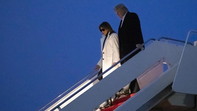 President Donald Trump and first lady Melania Trump step off Air Force One upon their arrival Wednesday, Feb. 26, 2020 at Andrews Air Force Base, Md. Trump is returning from India. (AP Photo / Alex Brandon)