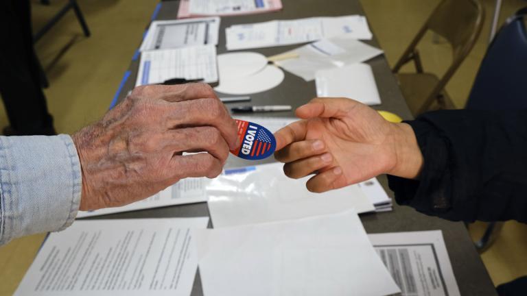 Early voter receives his I-Voted sticker, at an early voting polling station at the Ranchito Avenue Elementary School in the Panorama City section of Los Angeles on Monday, March 2, 2020. (AP Photo / Richard Vogel) Early voter receives his I-Voted sticker, at an early voting polling station at the Ranchito Avenue Elementary School in the Panorama City section of Los Angeles on Monday, March 2, 2020. (AP Photo / Richard Vogel)