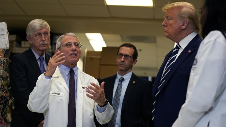 President Donald Trump listens as he tours the Viral Pathogenesis Laboratory at the National Institutes of Health, Tuesday, March 3, 2020, in Bethesda, Md. (AP Photo / Evan Vucci) President Donald Trump listens as he tours the Viral Pathogenesis Laboratory at the National Institutes of Health, Tuesday, March 3, 2020, in Bethesda, Md. (AP Photo / Evan Vucci)